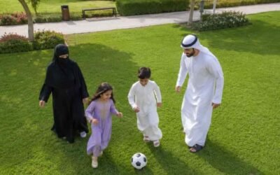 Family is playing with their childrens in the park
